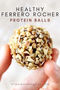 a hand holding a healthy ferreto rocher protein ball