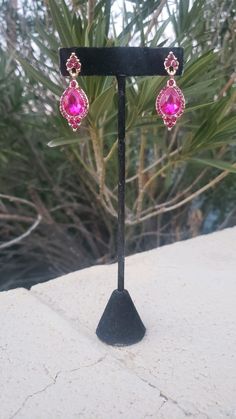 "These fun and stylish rhinestone long earrings with large crystals are a great statement piece! Pageant, prom, or bridal! Size of earrings: 1\" Wide and 3.25\" Long. colors available: Hot Pink Clip on available! Just select \"clip on\" under style looking for a bracelet to complete your look? check out this matching bracelet! :) https://www.etsy.com/listing/1156358468/fuchsia-rhinestone-bracelet-fuchsia-prom https://www.etsy.com/listing/587303889/fuchsia-bracelet-fuchsia-rhinestone?ref=shop_hom Pink Prom Earrings, Magenta Earrings, Hot Pink Prom, Hot Pink Bracelets, Fuchsia Necklace, Pink Clip, Prom Earrings, Pink Prom, Matching Bracelet