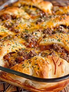 a casserole dish filled with meat and cheese