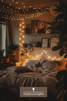 a bed that has some lights on the headboard and in front of it is a plant