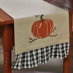 a table runner with a pumpkin on it