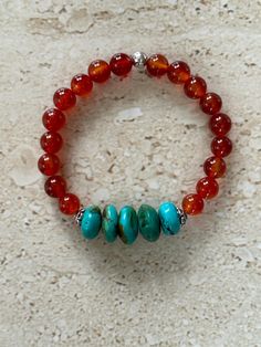 Turquoise Bracelet features 8MM smooth round carnelian stones and 10MM natural turquoise roundelle stones. Bracelet measures approximately 7 inches and is strung on stretch cord. Handmade GIFT BOXED Carnelian Bracelet, Carnelian Stone, Nature Bracelets, Natural Turquoise, Bracelet Handmade, Gemstone Bracelet, Handmade Bracelets, Turquoise Bracelet, Jewelry Bracelets