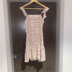 Elevate Your Summer Wardrobe With This Stunning Agua Bendita Target Dainty Floral Tile Flutter Sleeve Mini Dress In Blush. This Dress Features A Square Neckline And Side Zipper Closure, Making It Easy To Slip On And Go. The Flutter Sleeves And Ruffled Accents Add A Playful Touch. The Pink Floral Pattern Is Perfect For Any Occasion, Whether It's A Casual Day Out, A Party Or A Cocktail Event. The Dress Is Made Of High-Quality Rayon Fabric, Ensuring Comfort And Durability. It Is Available In Size M And Is Designed For Women Who Want To Look Their Best In Any Season. Lovely Fabric Floral Tile, Floral Tiles, Pink Floral Pattern, Cocktail Event, Rayon Fabric, Square Necklines, Mini Dress With Sleeves, Flutter Sleeves, Square Neckline