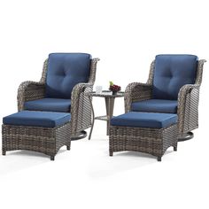 two wicker chairs with blue cushions and a small table