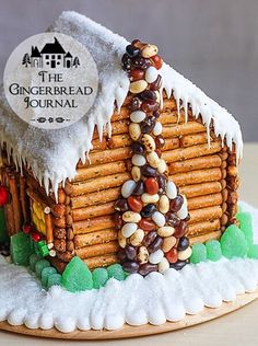 a gingerbread house made to look like it has been decorated with candy and nuts