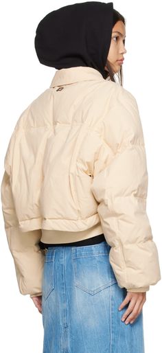 Layered down-filled quilted plain-woven cotton jacket. · Spread collar · Zip closure · Zip pockets · Rib knit cropped hem, and cuffs · Concealed bungee-style drawstring at hem · Logo hardware at back collar · Patch pockets at interior · Full satin and plain-woven lining Supplier color: Beige Fill: 90% down, 10% feather. Cotton Puffer Jacket For Fall, Cotton Puffer Jacket With Ribbed Cuffs, Long Sleeve Cotton Puffer Jacket With Ribbed Cuffs, Oversized Winter Outerwear With Zip Cuffs, Casual Cotton Puffer Jacket With Ribbed Cuffs, Winter Casual Cropped Jacket With Ribbed Cuffs, Trendy Cropped Jacket With Ribbed Cuffs For Winter, Casual Cropped Jacket With Ribbed Cuffs For Winter, Casual Winter Cropped Jacket With Ribbed Cuffs