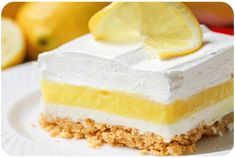 lemon lasagna on a white plate with two lemons in the background and text overlay that reads, lemon lasagna