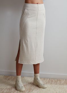 Paired with the Kenny Pullover, this ultra-cool sweatshirt skirt makes for a leveled up sweat set that will take you from lounging to brunch and beyond. How it fits: Easy slim fit. Fits close to body at waist ﻿How to style: ﻿Pairs with sneak for a casual lookMaterial: Cotton, PolyesterContent: 60% Cotton, 40% Polyester Stretch: LightLength: Regular Fit: Relaxed FitFeel: SoftTexture: MediumLined: Unlined Color: Grey Fitted Cotton Skirt For Loungewear, Casual Pencil Skirt For Loungewear, Casual Fall Loungewear Skirt, Cotton Stretch Skirt For Loungewear, Relaxed Fit Cotton Skirt For Loungewear, Relaxed Cotton Skirt For Loungewear, Casual Cotton Skirt For Loungewear, Sweat Set, Gray Skirt