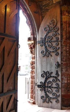 an open door with a decorative iron design on it