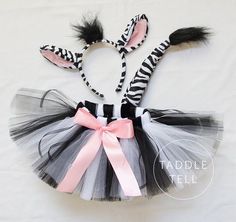 a zebra print headband and tutu skirt with matching hair clips