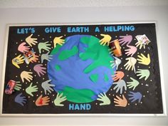 a bulletin board with hand prints on it that says let's give earth a helping