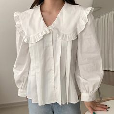 Long sleeve blouse with a pleated front and frilly oversized peter pan collar. Perfect statement piece on its own or layered under your favorite piece of choice. S: 14" across shoulders, 34.5" chest, 24" length M: 14.5" across shoulders, 36" chest, 24" length L: 15" across shoulders, 37.5" chest, 24.5" length XL: 15.5" across shoulders, 39" chest, 24.5" length Big Collar Blouse Outfit, Peter Pan Collar Blouse Outfit, Oversized Collared Shirt Outfits, Peter Pan Collar Outfit, Long Sleeve Under Shirt Outfit, Collar Blouse Outfit, Oversized Blouse Outfit, Big Collar Blouse, Oversized Collared Shirt