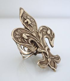 "Vintage Jewelry - Vintage Ring - Art Nouveau Jewelry - Fleur de Lis Ring - Vintage Brass Jewelry - Statement Ring - handmade jewelry This is such a cool ring! A gorgeous large Art Nouveau Fleur de Lis design set on a wide floral adjustable ring band. All USA vintage brass. It is adjustable and can fit on any finger. Just gorgeous! Chloe says, \"Wear it and feel fabulous!\" The ring measures stunning 2 1/4\" long and 1 1/2\" wide. Adjustable up to size 9. *Thank you for visiting Chloe's*" Unique Rings With Lost Wax Casting As Gift, Art Nouveau Sterling Silver Rings As Gift, Art Nouveau Sterling Silver Rings As A Gift, Art Nouveau Sterling Silver Gift Rings, Art Nouveau Adjustable Jewelry For Gifts, Art Nouveau Adjustable Jewelry As A Gift, Artistic Collectible Jewelry Ring, Adjustable Art Nouveau Jewelry As Gift, Handmade Adjustable Antique Rings