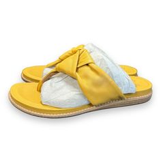 Step Out In Style With These Beautiful Women's Sofft Essie Mexico Sandals. The Vibrant Yellow Color Will Surely Brighten Up Your Day. These Slip-On Sandals Are Perfect For Travel And Casual Occasions. Crafted With High-Quality Leather And A Rubber Outsole, These Sandals Are Durable And Comfortable. The Cushioned Insole And Breathable Lining Material Provide All-Day Comfort. These Sandals Come In A Medium Size And Are Part Of The Sofft Product Line. Add These Stylish Sandals To Your Collection Today! Yellow Cushioned Slip-on Slippers, Yellow Slip-on Casual Slippers, Yellow Casual Slip-on Slippers, Comfortable Yellow Slip-on Flip Flops, Comfortable Yellow Flip Flops, Yellow Summer Flip Flops For The Beach, Yellow Flip Flops For Vacation, Yellow Synthetic Slides For The Beach, Yellow Open Toe Flip Flops For Beach