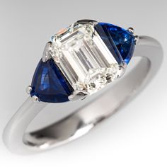 a three stone diamond and blue sapphire ring