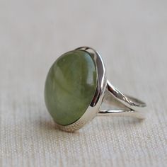 Gemstone - Green Prehnite Gemstone Size -18 mm Round Metal - Sterling Silver Ring size - All sizes available Each Ring made with Precision and love, these rings are perfect for everyday use and a perfect accessory to wear at work. Rings can be customized on request and gemstones can be switched to any other as per requirement. Same design also uploaded with Blue Chalcedony, Hematite, Carnelian, Crystal Quartz, Labradorite, Rainbow Moonstone, Smoky quartz kindly visit my store to view the complet Adjustable Peridot Jewelry For Anniversary, May Birthstone Ring With Polished Finish, Green Promise Ring Jewelry With Round Stone, Green Jewelry With Large Round Stone, May Birthstone Jewelry With Large Round Stone, Green Oval Cabochon Ring With Bezel Setting, Green Rings With Large Stone For May Birthstone, Round Peridot Jewelry With Polished Finish, Silver Peridot Rings With Polished Finish