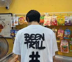 a man wearing a t - shirt with the words been trill written on it