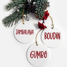 two christmas ornaments with the words gumbo and tambalya on them