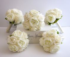 white bridals are arranged on top of a box