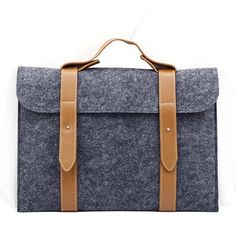 Designed for the nostalgics, this 15-inch wool laptop sleeve should help you remember the good old days on the school benches. Characteristics Laptop sleeve Material: wool felt Designed for 15-inch laptops Button closure Back zipper pocket Top handle Available in 2 colours Laptop sleeves You just got a brand new laptop, you spent hours at home installing your most essentials apps & software (Spotify, Netflix, etc.), your antivirus is up and running, everything is going as planned for you and you Laptops And Tablets, New Laptop, New Laptops, Deep Gray, Leather Laptop, Leather Sleeve, The Good Old Days, Hard Drive, Carrying Case