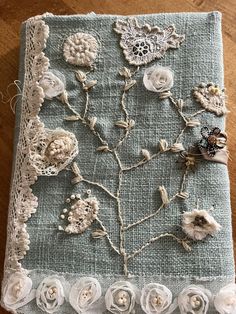 a piece of cloth with flowers and lace on it