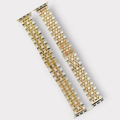 Introducing the Stainless Apple Watch Band Designed for individuals who appreciate a blend of Silver-Gold jewelry in their accessories. Easy to adjust to ensure a comfortable fit, this watch band is available in sizes 38/40/41MM or 42/44/45/49MM to accommodate all Series of Apple Watches. Apple Watch Series 10 (42MM)-(46MM) Highlight your style with this beautiful watch band that effortlessly combines sophistication and functionality. Key features include a seamless stainless steel construction Adjustable Gold Watch Band, Modern Watch Band Accessories As Gift, Gold Watch Band As Gift, Gold Adjustable Watch Accessories, Metal Rectangular Watch Bands With Bracelet Strap, Rectangular Metal Bracelet Strap Watch Bands, Apple Watch Stainless Steel, Apple Watch Stand, Handmade Watch Bands