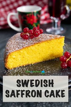 a slice of swedish saffron cake on a plate with berries and coffee mug in the background