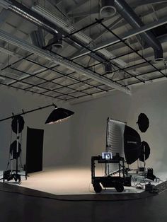 an empty photo studio with lighting equipment