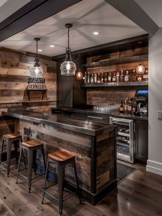 a home bar with stools and wooden walls