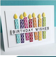 a birthday card with colorful candles on it