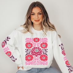 Get ready to turn heads and spread positive energy with our hippie style sweatshirt featuring a vibrant, eye-catching boho flower pattern on the front and on the sleeves. Designed for free spirits, this cozy sweater is a must-have for those who love to express their individuality. The colors of the design are berry, pink, red and some purple, the trendy colors for spring 2024! Perfect for those who appreciate the laid-back, carefree spirit of the 60s and 70s. Whether you're heading to a music fe Long Sleeve Graphic Print Hippie Top, White Crew Neck Hippie Top, White Bohemian Cotton Sweater, White Cotton Bohemian Sweater, Spring Bohemian Cotton Sweatshirt, Bohemian Cotton Sweater Relaxed Fit, Bohemian Cotton Sweater With Relaxed Fit, Bohemian Relaxed Fit Cotton Sweater, Bohemian Cotton Sweater In Relaxed Fit