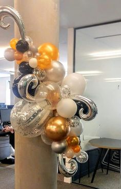 an office decorated with balloons and streamers