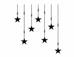 black and white image of stars hanging from the ceiling with long lines attached to them