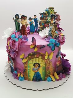 a birthday cake decorated with the characters from disney's animated movie