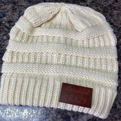 You will be styling this winter in this warm and soft unisex adult leather patch beanie hat. Each hat is made of 100% soft acrylic and stretches to fit most heads. The real leather engraved patch is adhered to the band of the beanie hat. Choice of 2 designs beautiful crazy small town girl with state of Ohio Choice of patch color dark leather (lighter engraving) light leather (dark engraving) Choice of 4 beanie colors black gray maroon off white Check out our camo leather patch ball caps in our G Ohio Girls, Leather Engraved, Patch Beanie, State Of Ohio, Beautiful Crazy, Leather Engraving, Girl Beanie, Small Town Girl, Ball Caps