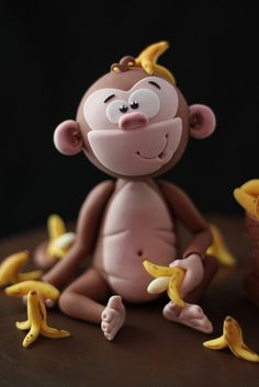 there is a cake with a monkey and bananas on it