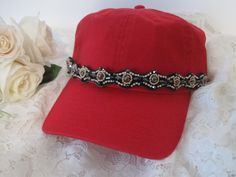 I designed this light weight red trucker baseball hat with gorgeous rhinestone and beaded trim. Perfect for those bad hair days. Has a adjustable pony tail back. See more of my trucker baseball cadet hats here: https://www.etsy.com/shop/theraggedyrose?ref=seller-platform-mcnav&section_id=10557807 Thanks for visiting my shop Adjustable Rhinestone Baseball Cap With Curved Brim, Casual Adjustable Baseball Cap With Rhinestones, Trendy Rhinestone Adjustable Baseball Cap, Rhinestone Baseball Cap One Size, Rhinestone Embellished One Size Baseball Cap, Adjustable Baseball Cap With Bling, Red Adjustable Fitted Baseball Cap, Adjustable Baseball Cap With Curved Brim For Party, Adjustable Snapback Baseball Cap For Party