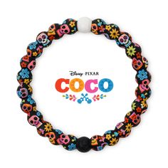 the disney pixar coco bracelet is decorated with skulls and flowers