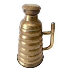 a brass colored coffee pot with a handle