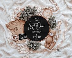 this is the last one seriously to november baby announcement with flowers, teddy bears and other items