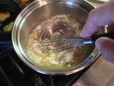 someone is mixing something in a bowl on the stove