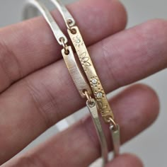 "Sterling silver and 14k gold \"Diamond Bar Wildflower Bangle\". The Gold bar has a hand-patterned wildflower garden with three sparkly white diamonds. Details: *Gold bar - 1 1/4\" L x 3mm W x 1.25mm thick Diamonds - 1.7mm white - Conflict-free Gold - 14k yellow - Eco-friendly, recycled Sterling Silver - Eco-friendly, recycled Choose size at checkout. *This items is Made-to-order. *Please see my shop's home page announcement for current production time. https://www.etsy.com/shop/LilianGinebra?re Diamond Engraved Bracelet Gift, Engraved Diamond Bracelet As Gift, Engraved Diamond Bracelet For Gift, Bangle Diamond, Jewelry Bride, Antler Jewelry, Gold And Silver Bracelets, Metal Clay Jewelry, Bride Jewelry