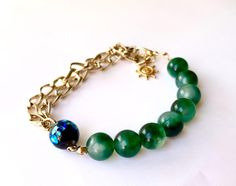 This is a Genuine Natural Jade Cahain Bracelet . Material : Genuine Japanese Natural Jade Jade size:  approx 10 mm Ceramic beads : approc 12 mm Inner diameter : approx  17 cm - 22 cm Condition : Excellent/ please check photo Please don't hesitate to contact me if you have any question!! Please see other items. https://www.etsy.com/jp/shop/YUMEYAKKOJapan?ref=hdr_shop_menu Handmade Elegant Aventurine Bracelets, Luxury Green Round Bead Bracelets, Luxury Green Beaded Bracelets For Gift, Elegant Aventurine Bracelet Jewelry, Elegant Aventurine Bracelet, Green Handmade Bracelets For Formal Events, Green Handmade Bracelets For Formal Occasions, Handmade Bracelets Tutorial, Bracelet Chain