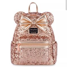 Bought At Disney But Never Wore. Paid Full Price For It. Plz Be Reasonable With Offerssells For 140 On Amazon. Five Star Product. This Minnie Mouse Sequin Loungefly Mini Backpack Speaks To You In The Universal Language Of Glamour With An Accent Of Bling. The Allover Sequin Design Features Minnie's Signature Ears And Bow, And Every Inch Shimmers In Rose Gold. The Sparkle Is All You. Magic In The Details Sequin Design With Simulated Leather Trim Bow And Ear Appliqus Double Zip Main Compartment Polka Dot Fabric Interior Lining Loungefly Logo Metal Pulls Rose Goldtone Finish Hardware Adjustable Padded Shoulder Straps Top Carry Handle Side Slip Pockets Disney Parks X Loungefly Logo Loungefly Mini Backpack, Sequin Backpack, Mini Mochila, Loungefly Bag, Rose Gold Sequin, Sequin Design, Disney Bag, Disney Shop, Dot Fabric