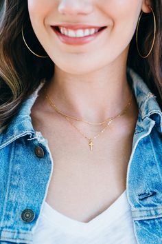 Tiny gold cross necklaceThis cross necklace is so tiny and cute!  14kt gold filled chain and 24kt gold vermeil cross. Charm measures just 7mm long, so cute! Perfect for everyday.Looks great all by itself or layered with another dainty necklace. ( The model is wearing our satellite necklace: http://etsy.me/2yIpuw6 )Details: - 24kt gold vermeil charm, 14kt gold filled chain- made from excellent quality materials, won't tarnish or turn- Choose your necklace length at check out. Model wearing 17 inc Dainty Yellow Gold Cross Necklace For Everyday, Dainty 14k Gold-filled Cross Necklace, Dainty Cross Necklace With Delicate Chain For Everyday, Dainty Everyday Cross Necklace With Delicate Chain, Dainty 14k Gold Cross Necklace For Everyday, Dainty Everyday 14k Gold Cross Necklace, Gold Cross Necklace With Delicate Chain For Everyday, Everyday Gold Cross Necklace With Delicate Chain, Everyday Yellow Gold Cross Charm Necklace