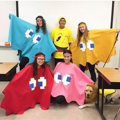 several people in costumes posing for a photo