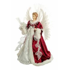 an angel figurine with white wings and red dress