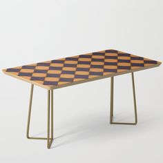 a table with a checkerboard design on the top and metal legs, sitting in front of a white background