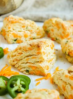 cheesy biscuits and green peppers on a white plate