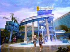 two people are walking through the water park